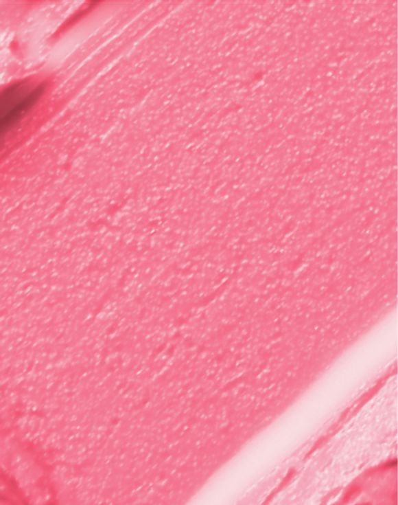Close-up of pink creamy lip balm texture