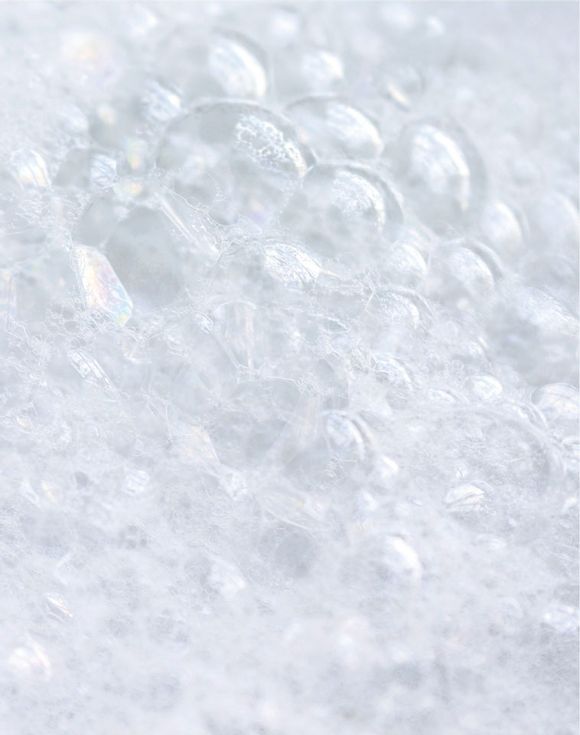 Close-up of iridescent bubble bath foam bubbles