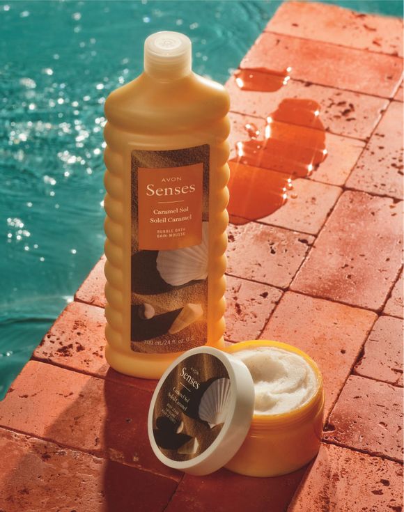 Avon Senses Caramel Sol Bubble Bath and Body Scrub by poolside on terracotta tiles