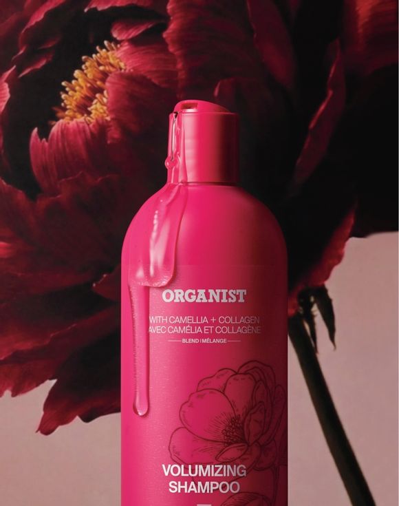 Organist Volumizing Shampoo bottle with camellia flower background