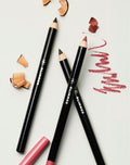 fmg Glimmer Lip Pencils lifestyle flat lay with color swatches