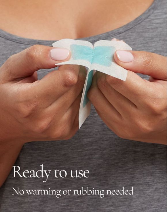 Woman applying Schick Hydro Silk wax strip to upper lip area