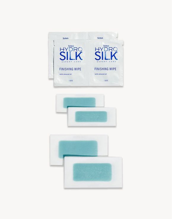 Schick Hydro Silk wax strips and finishing wipes laid flat on white background