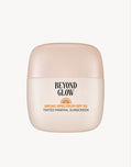 Beyond Glow Tinted Mineral Sunscreen SPF 50 bottle in sand with pool float