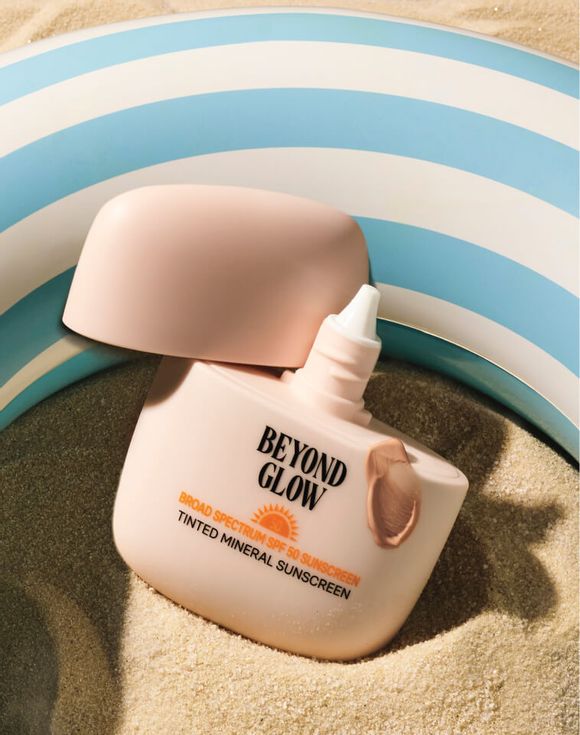 Beyond Glow Broad Spectrum SPF 50 Tinted Mineral Sunscreen bottle on white background