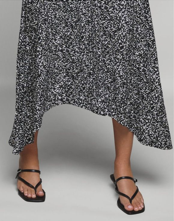 Patterned Dress – close-up of handkerchief hem and sandals on model