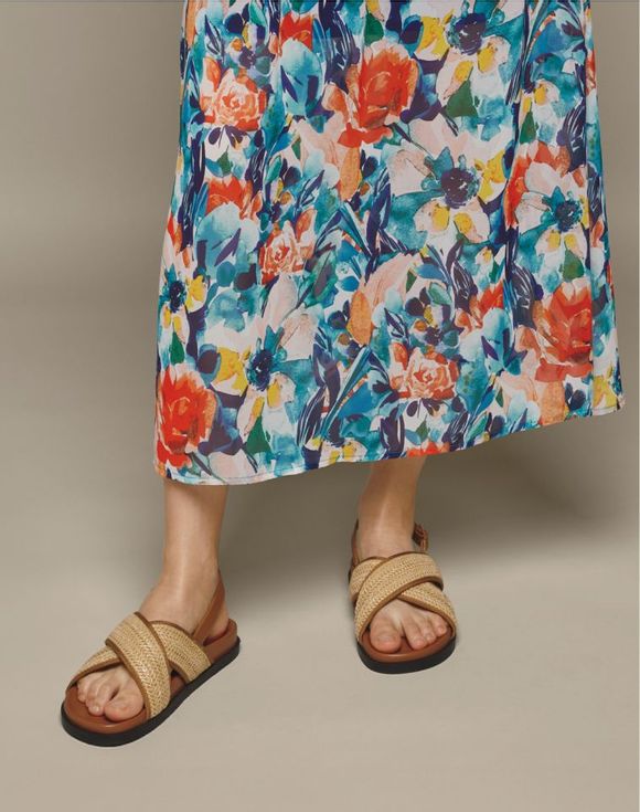 Footbed Sandal - side view model wearing sandals showing slingback strap and rubber outsole