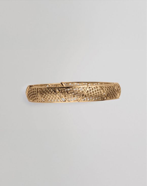 Filigree Fusion Stretch Bracelet side view showing full gold-tone bangle profile
