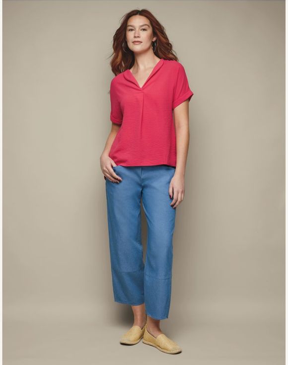 Full outfit with gold espadrilles, blue trousers and pink top