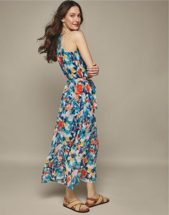 Floral Sleeveless Dress – model wearing dress, back view showing tiered skirt