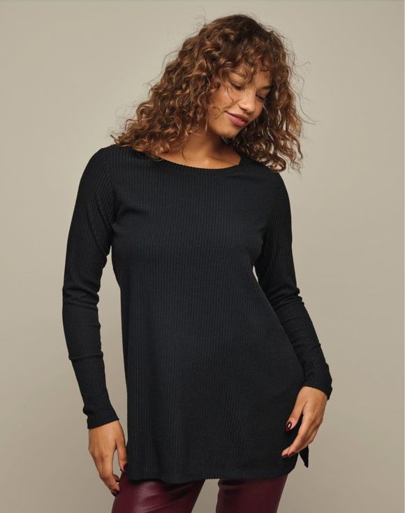 Rib-Knit Tunic - model wearing black tunic with arms raised