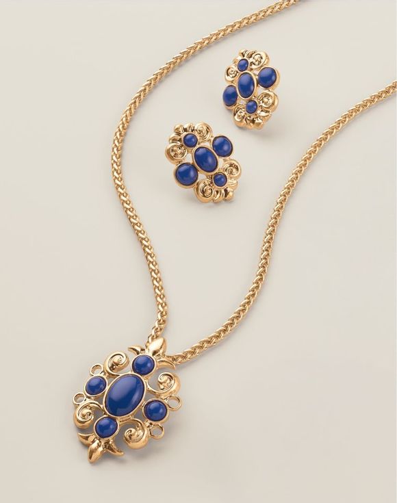 Royal Blue Crown Statement Earrings close-up showing ornate gold-tone scroll setting with royal blue cabochon stones