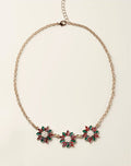 Classic Poinsettia Necklace full view on gold-tone chain