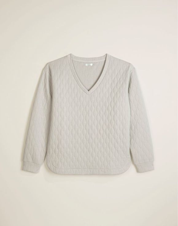 Quilted V-Neck Top side/hem detail on model
