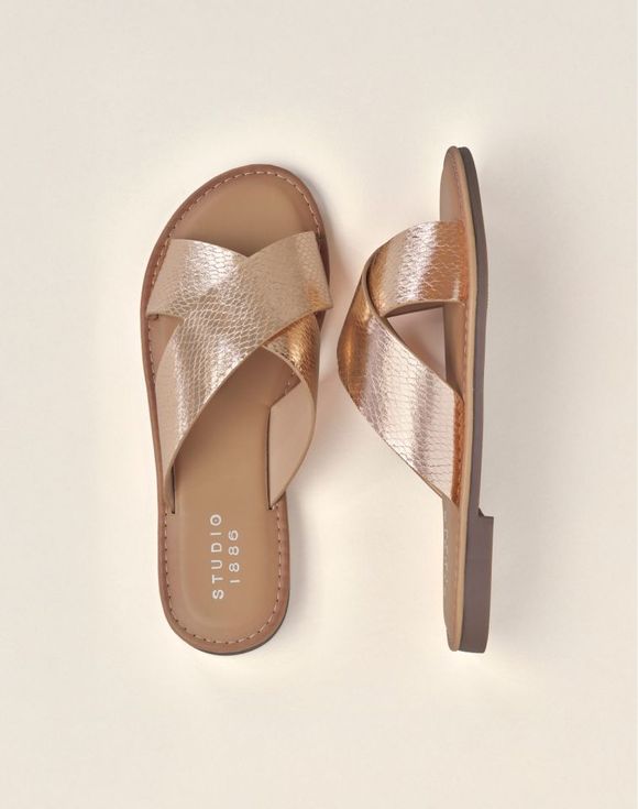 Rio Sandals - flat lay with straw hat and dragon fruit showing rose gold metallic slides