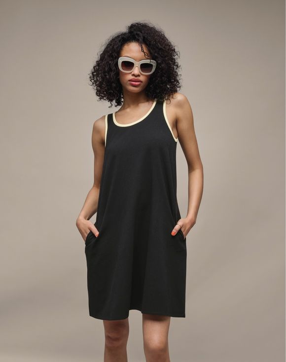 Tank Dress – model wearing black tank dress, front view with sunglasses
