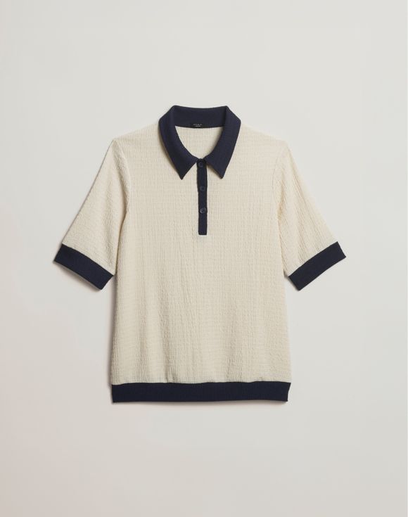 Two-Tone Top - side view showing boxy silhouette and navy cuffed sleeve