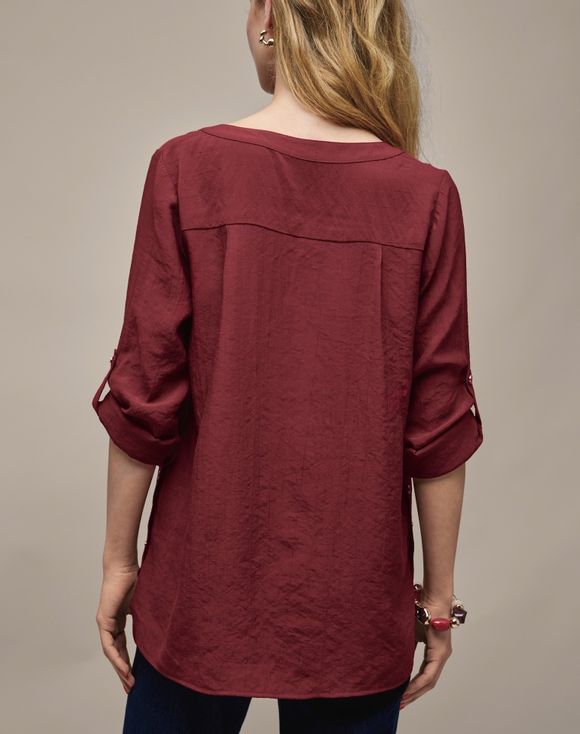 Button Detail Top - model back view showing roll-tab sleeves and curved hem