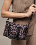 Animal Print Bag - model holding leopard print satchel by top handles