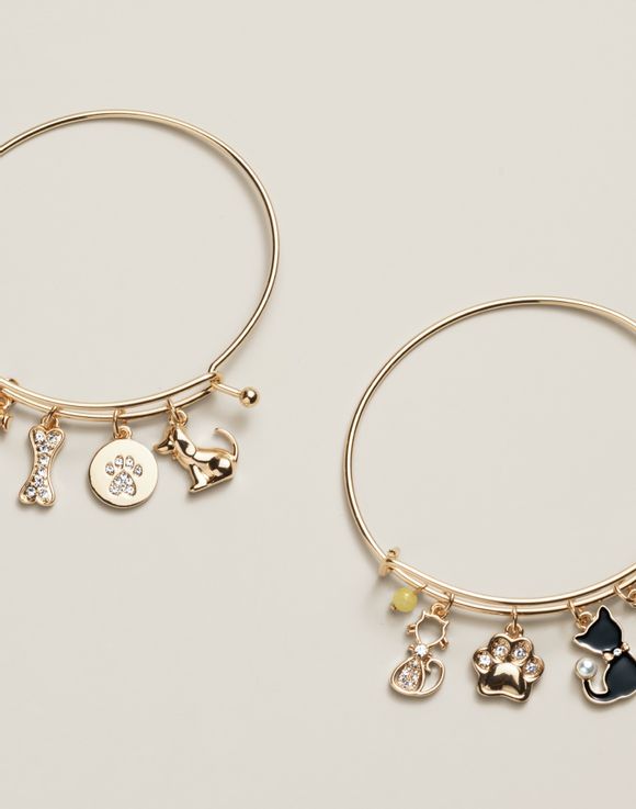 Cat and dog charm bangles side by side