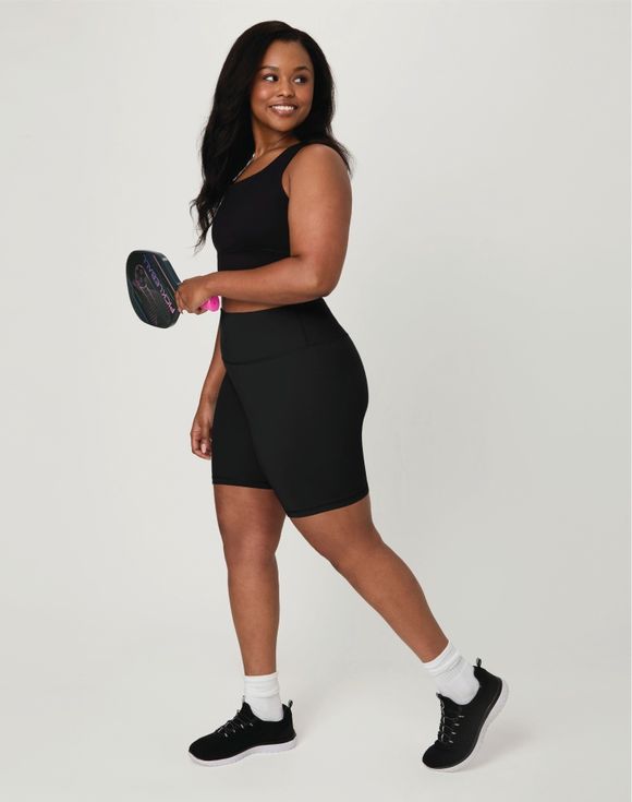 Hanes Moves 7 inch Bike Shorts black plus size model with pickleball paddle