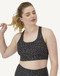 Hanes Moves Racerback Sports Bra leopard print front view plus size model